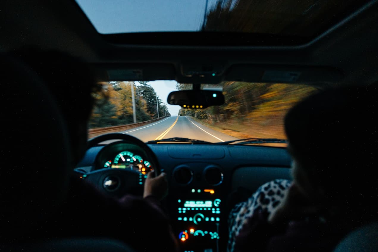 A country road ahead, seen from inside a car