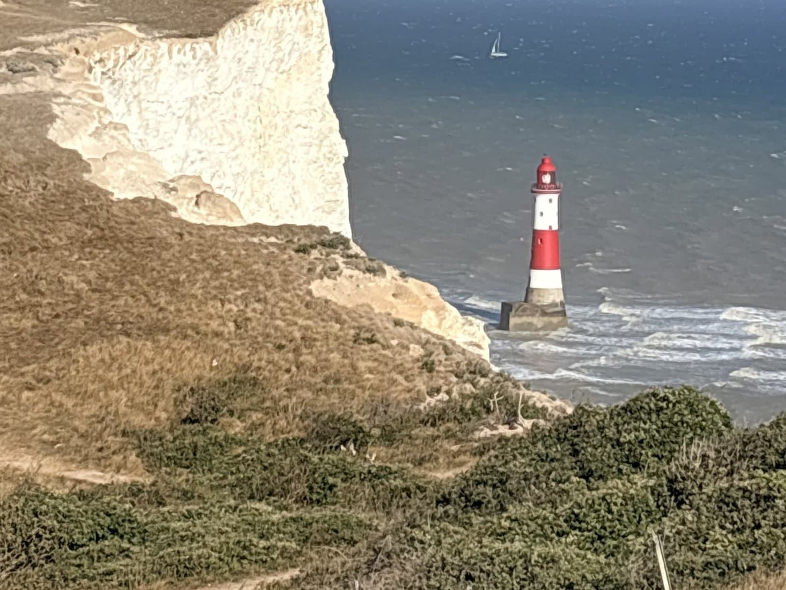 Beachy Head Lighthouse in the sea below the cliffs