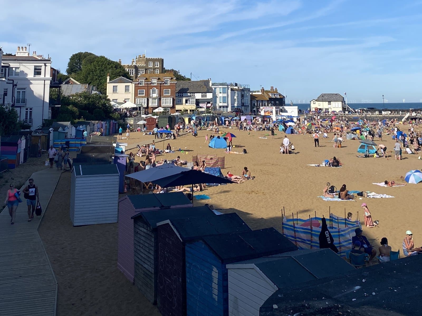 Beach huts and sand at Viking Bay