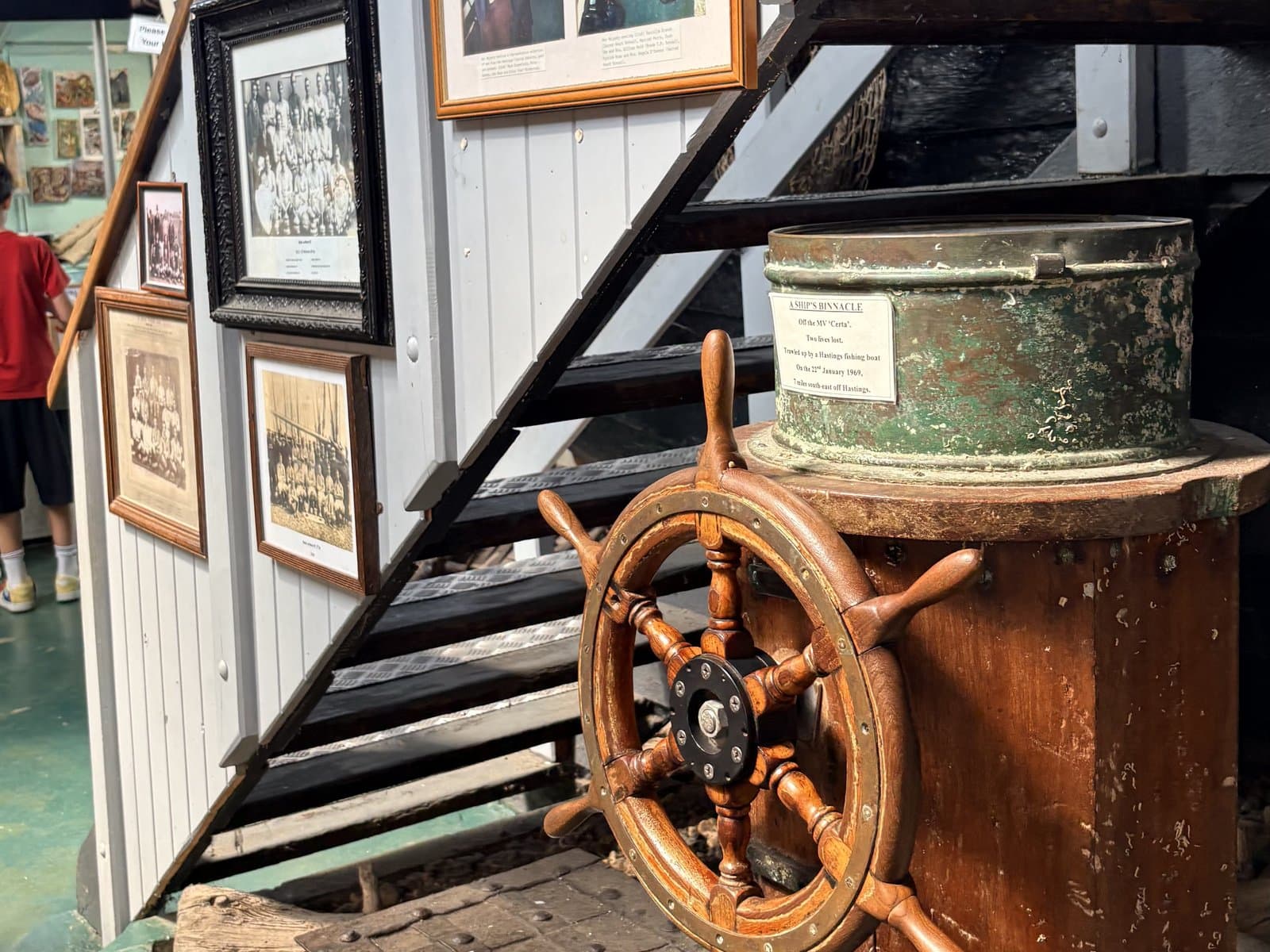 A ship's wheel and photographs in the Fishermen's Museum