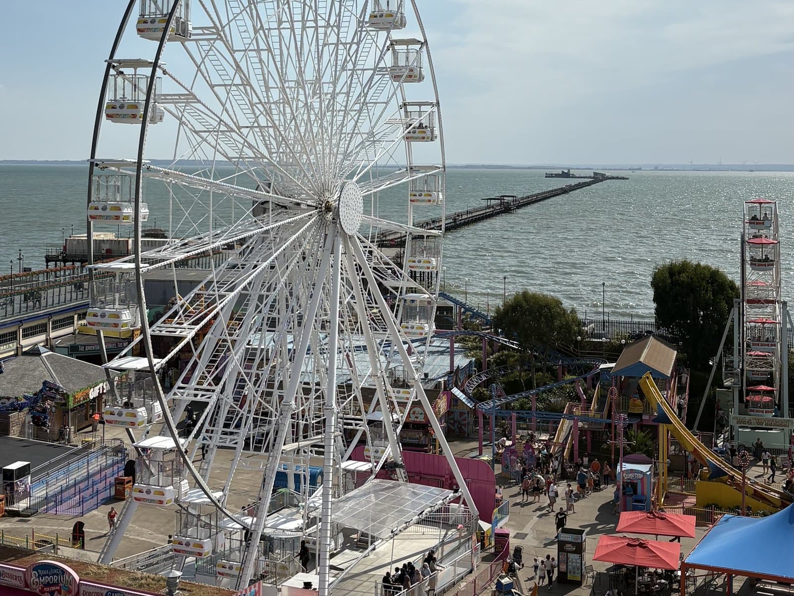 The big wheel at Adventure Island with the pier behind