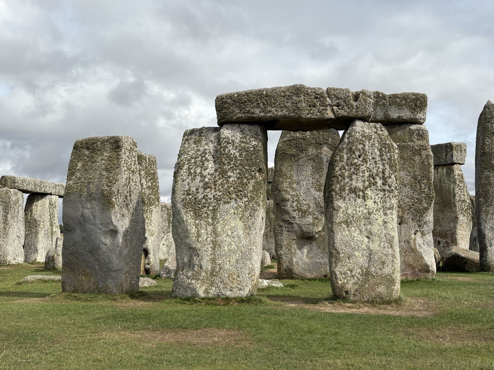 The sarsen stones of Stonehenge under a cloudy sky